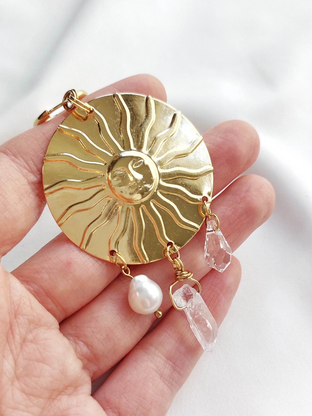 APOTHEOSIS single-loop medallion sun