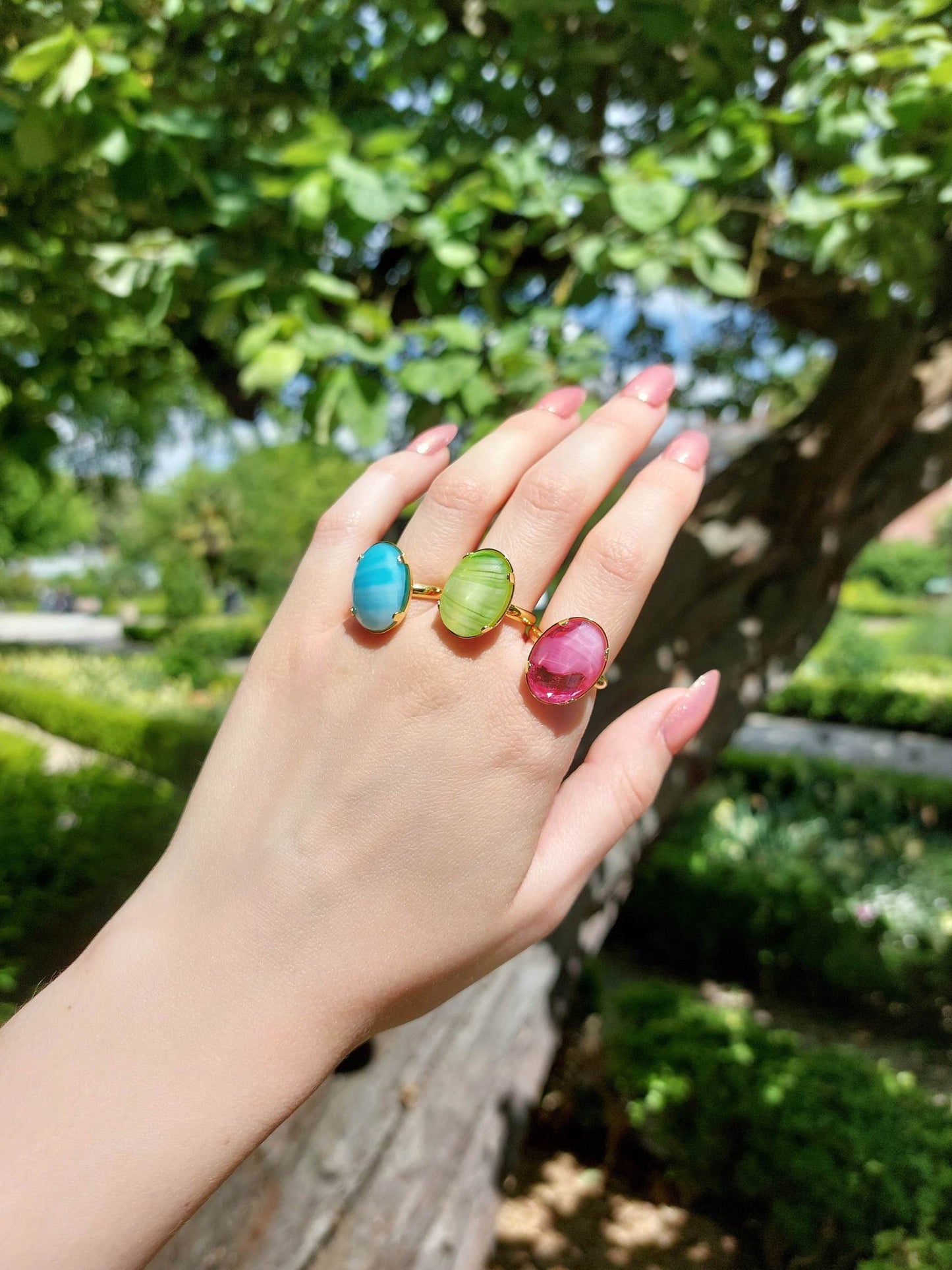Adjustable gold-plated ring with green cabochon