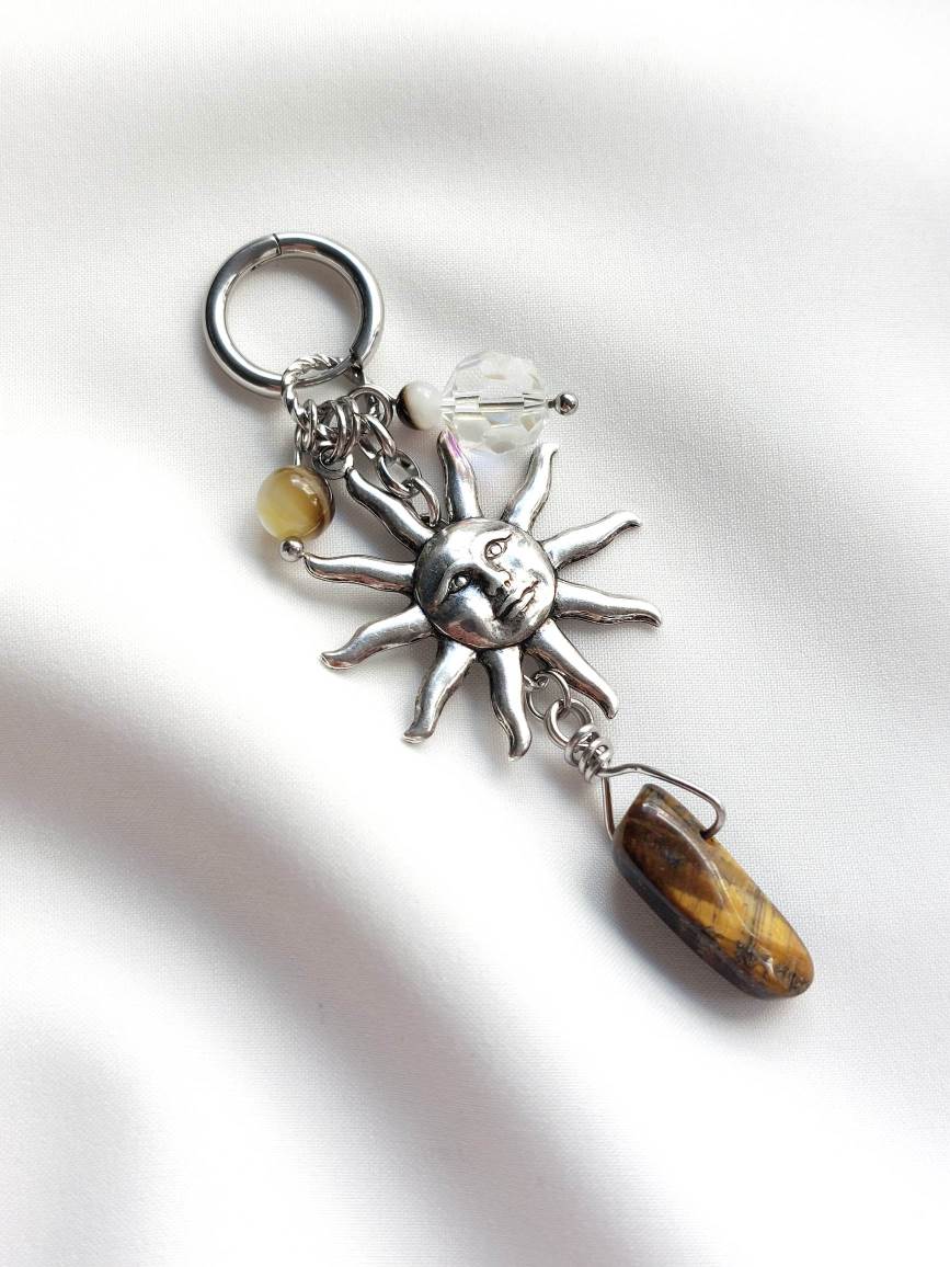 REINCARNATION single loop silver and brown sun