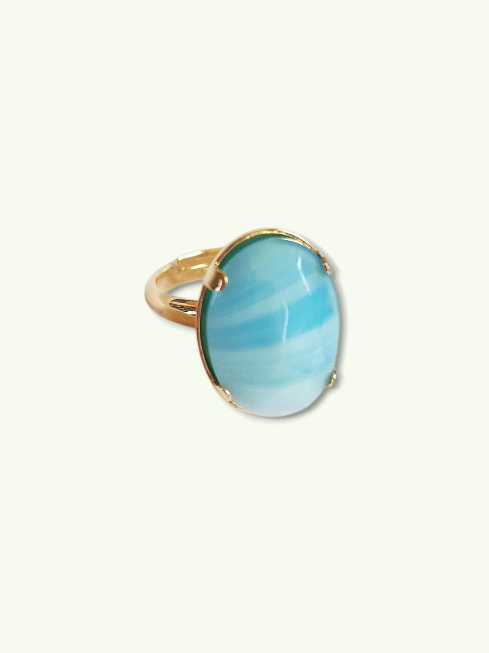 Adjustable gold ring with blue cabochon