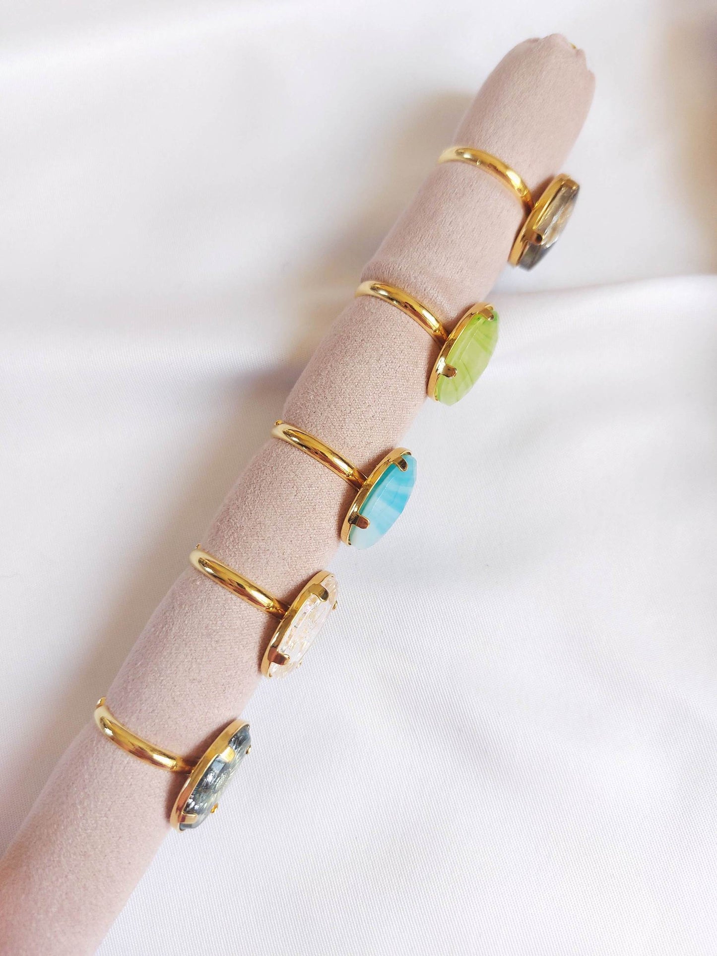 Adjustable gold ring with blue cabochon