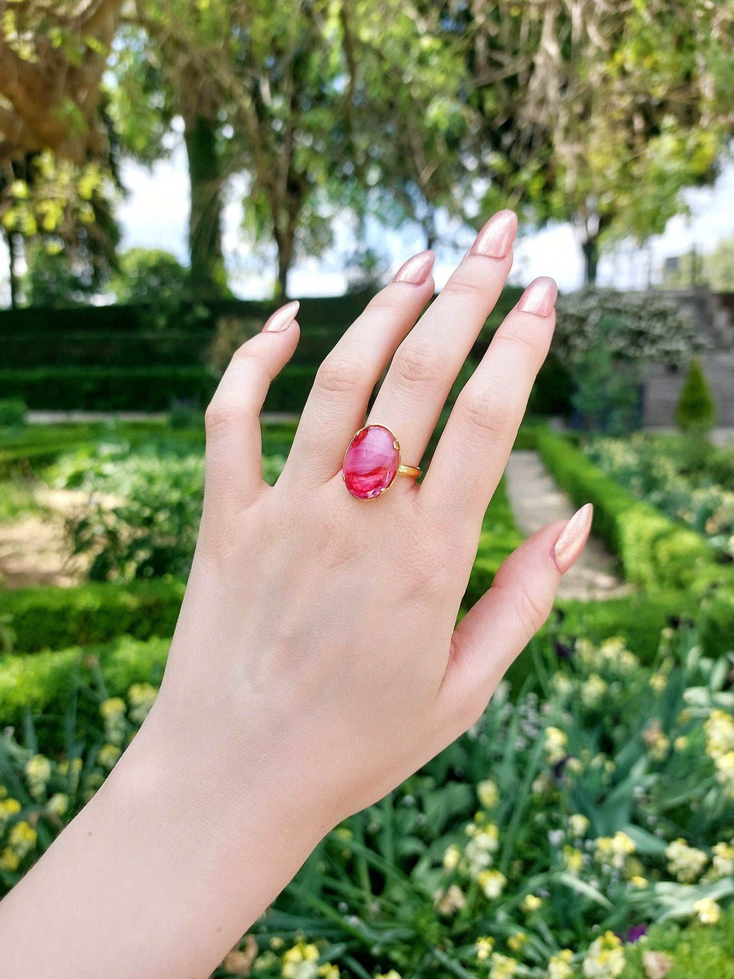 Adjustable gold ring with pink cabochon