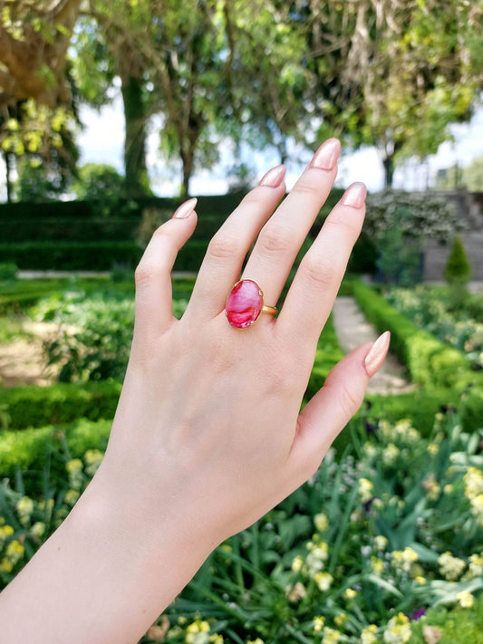 Adjustable gold ring with pink cabochon