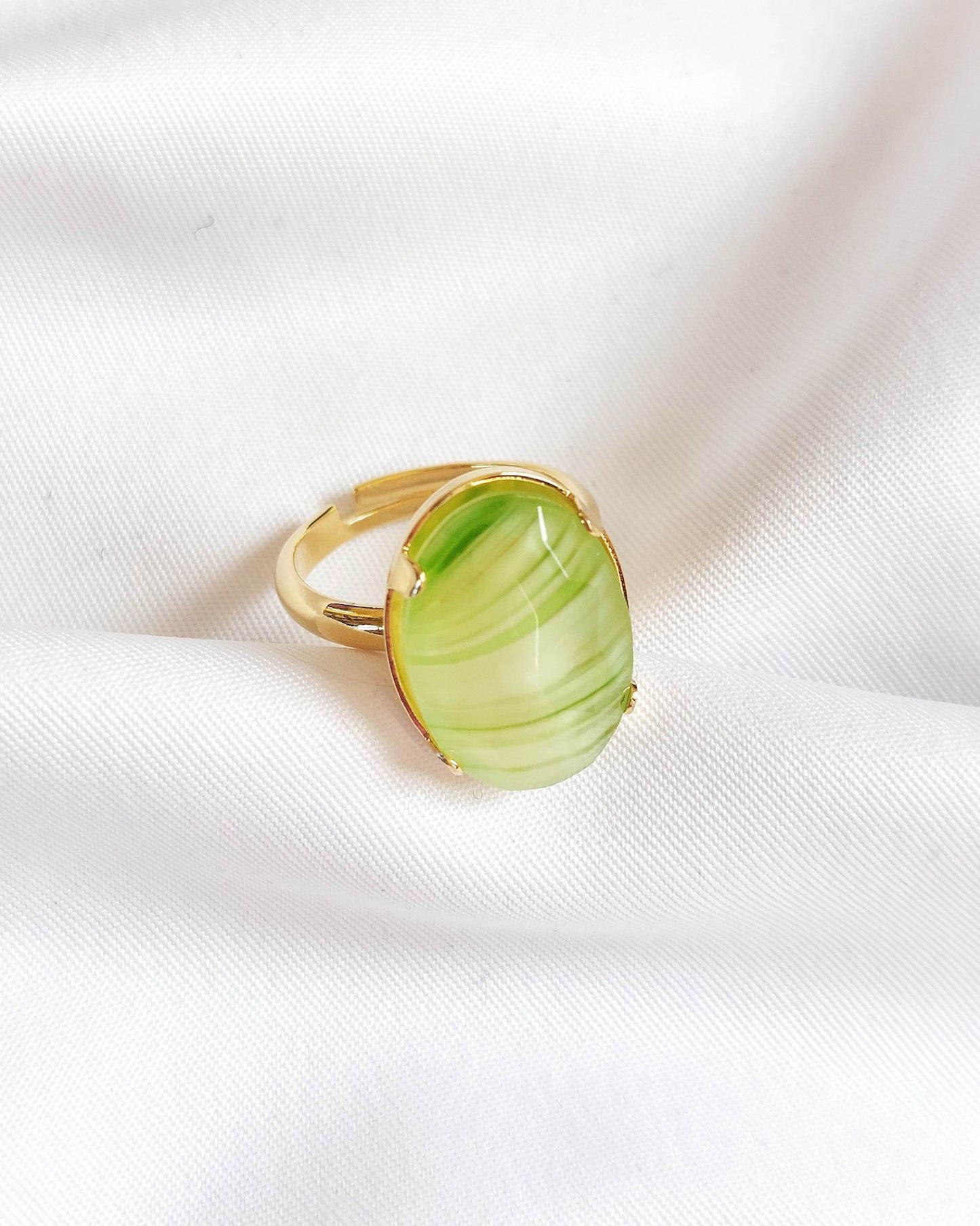 Adjustable gold-plated ring with green cabochon