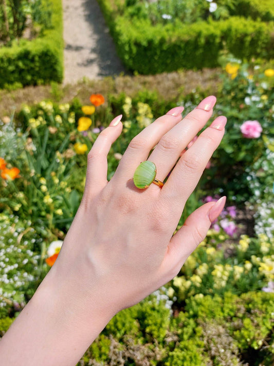 Adjustable gold-plated ring with green cabochon